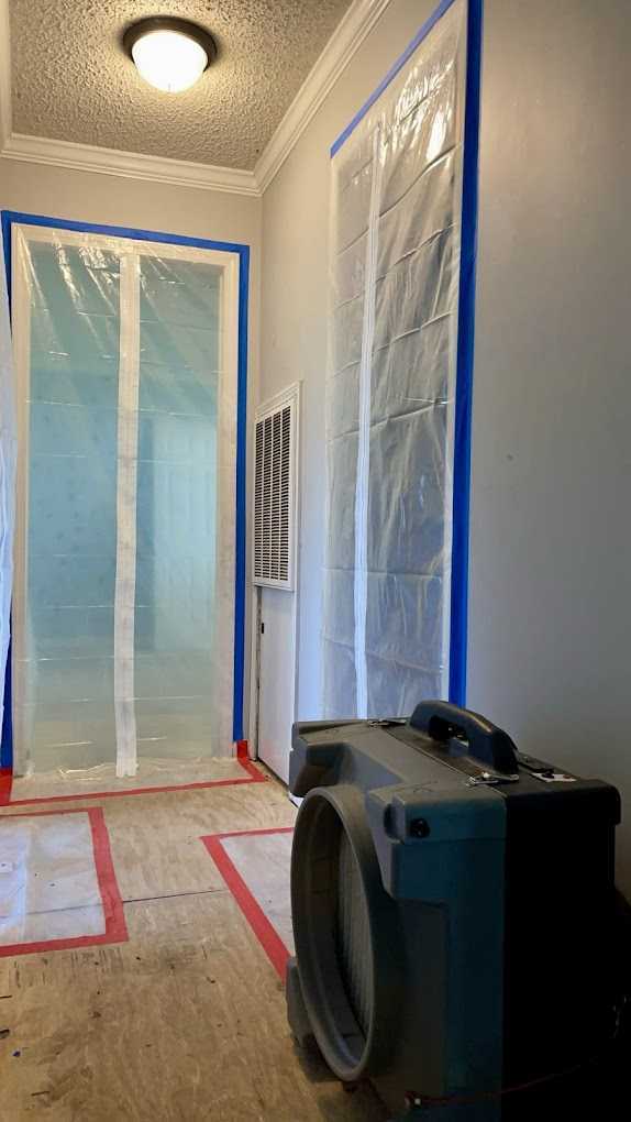 Containment barrier with a zippered entry on a Peak remediation job